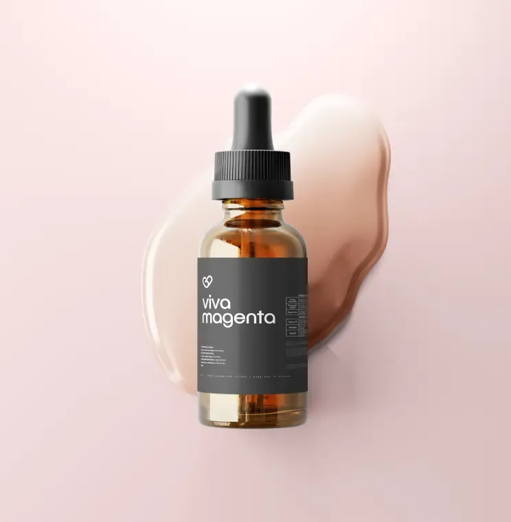 Amber dropper bottle with a black polypropylene Viva Magenta label on a pink background