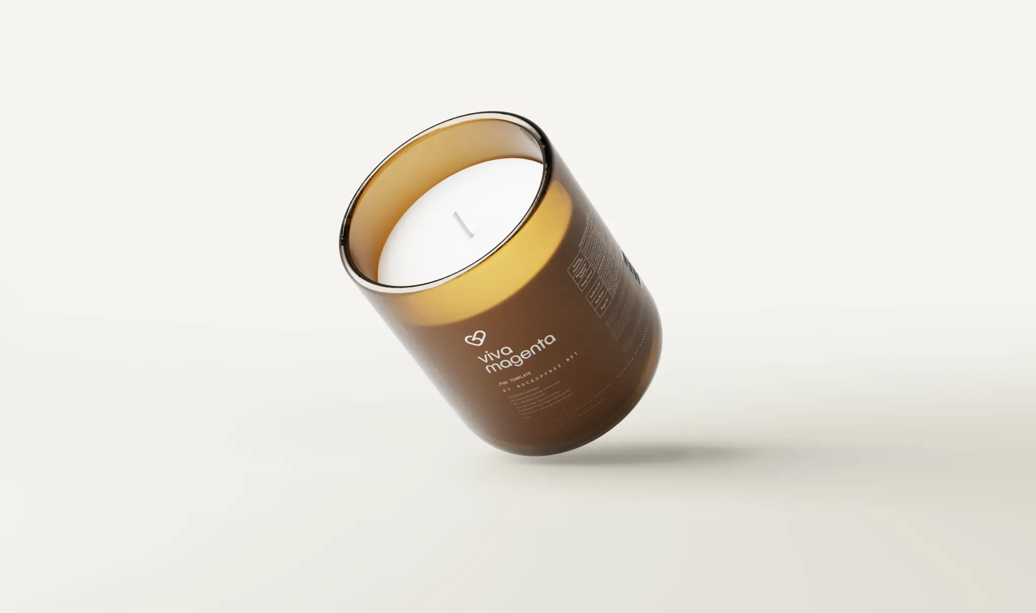 Amber glass candle jar with a clear Viva Magenta label