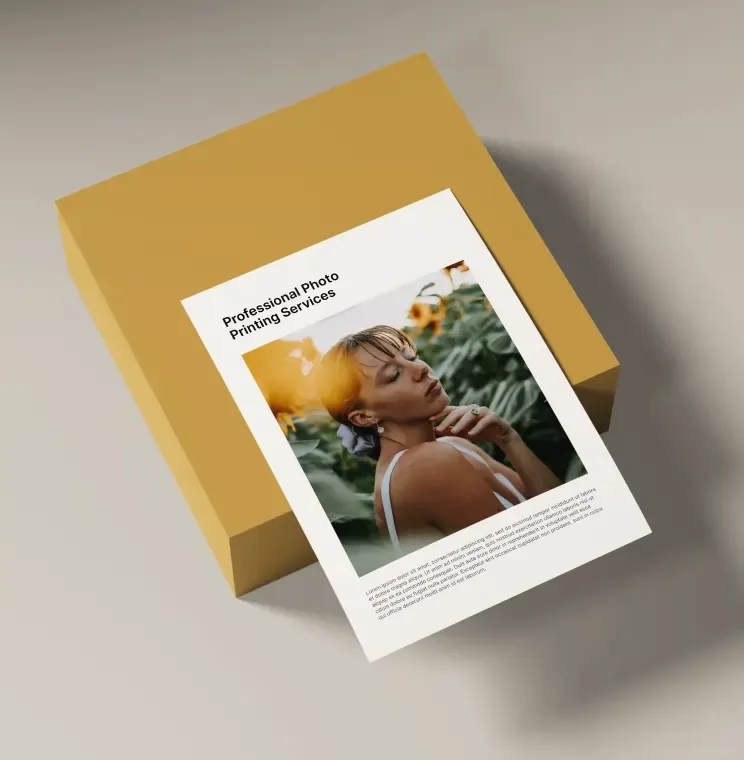 Printed photo card resting on a mustard-yellow gift box