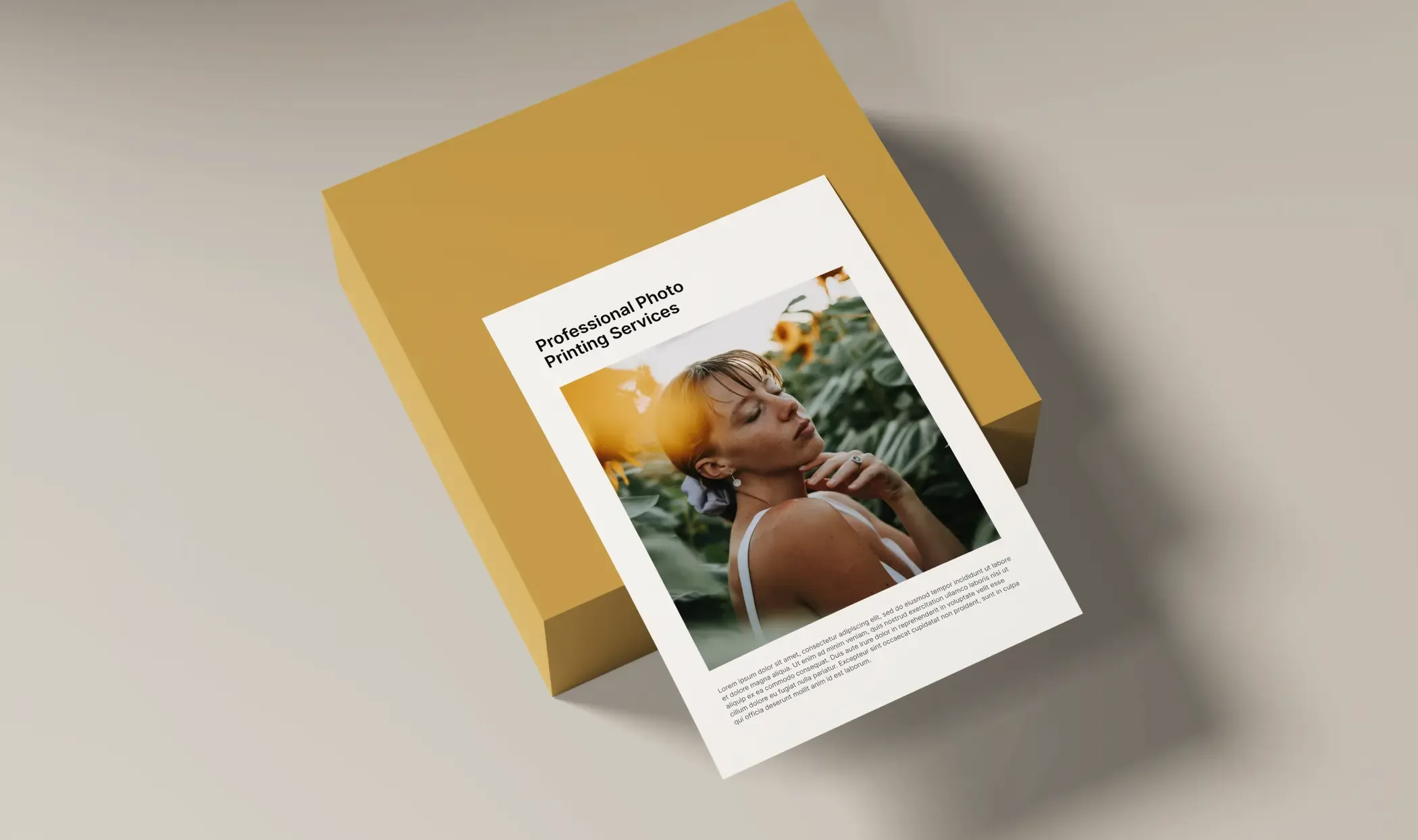 Printed photo card resting on a mustard-yellow gift box