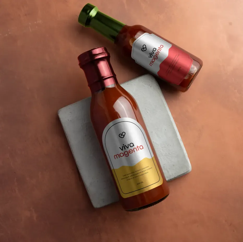 Sauce bottles with red and gold Viva Magenta labels