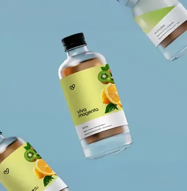 Juice bottles with fruit-illustrated Viva Magenta labels