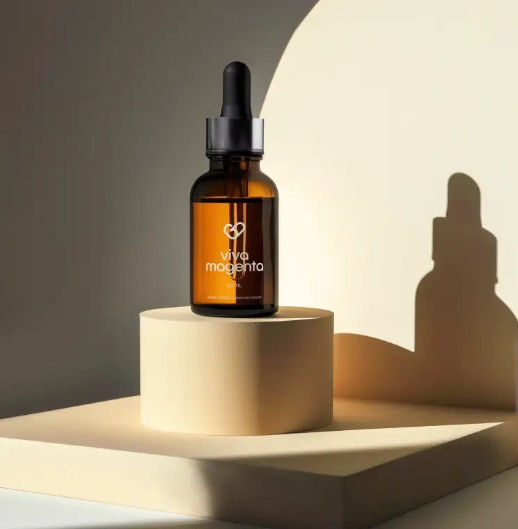 Amber dropper bottle with an ultra-clear label on a plinth